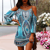 Blauwe jurk met koude schouderprint