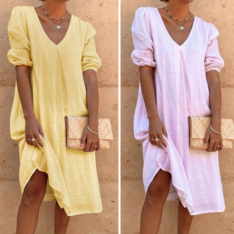 Solid color V-neck dress with lateral sleeves