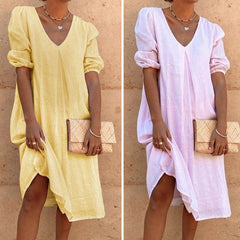 Solid color V-neck dress with lateral sleeves