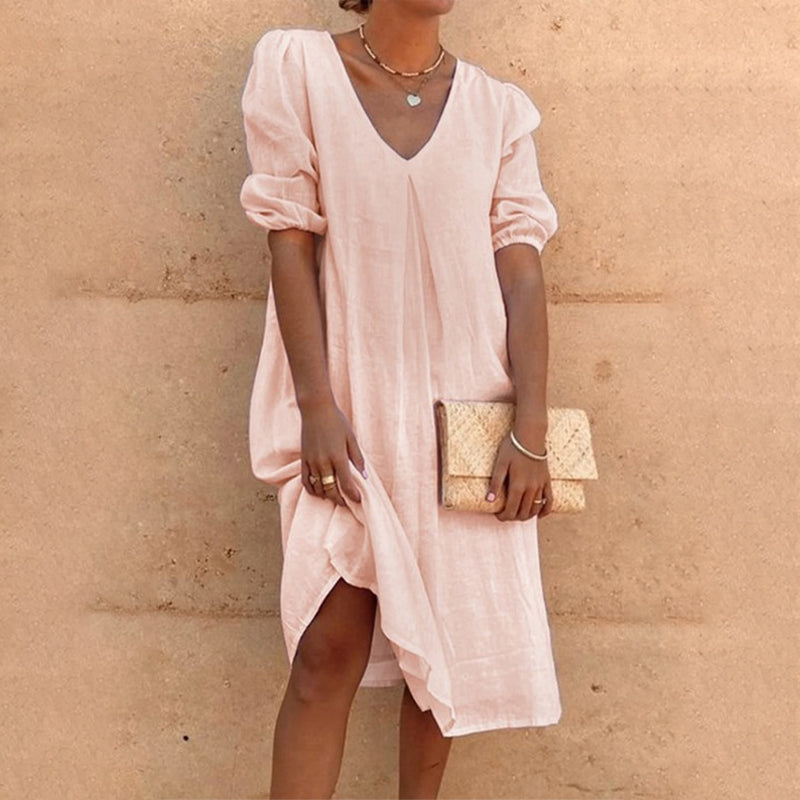 Solid color V-neck dress with lateral sleeves