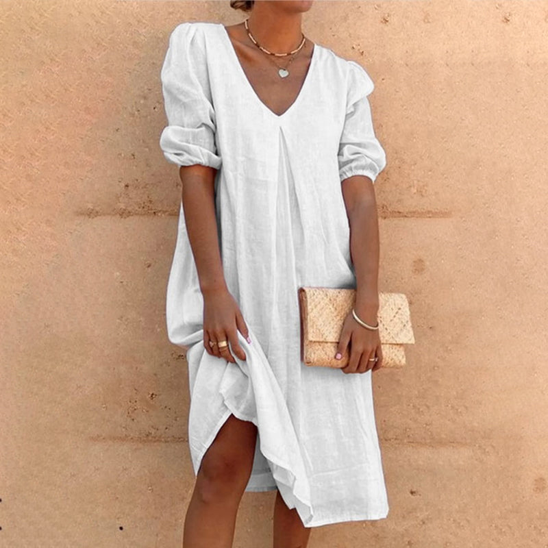 Solid color V-neck dress with lateral sleeves