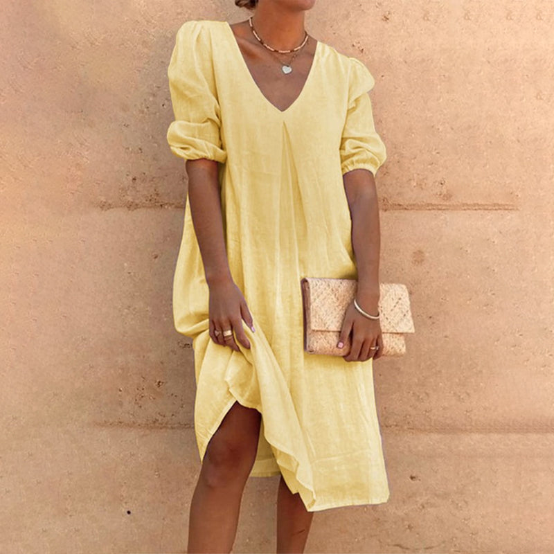 Solid color V-neck dress with lateral sleeves